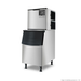 Stainless steel ice machine on a white background