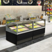 Frozen food display case in a modern kitchen setting with various items on shelves.