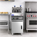 Commercial kitchen equipment including a fryer and oven in a professional kitchen setting.