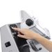Hand pressing a button on an electronic device with a white background