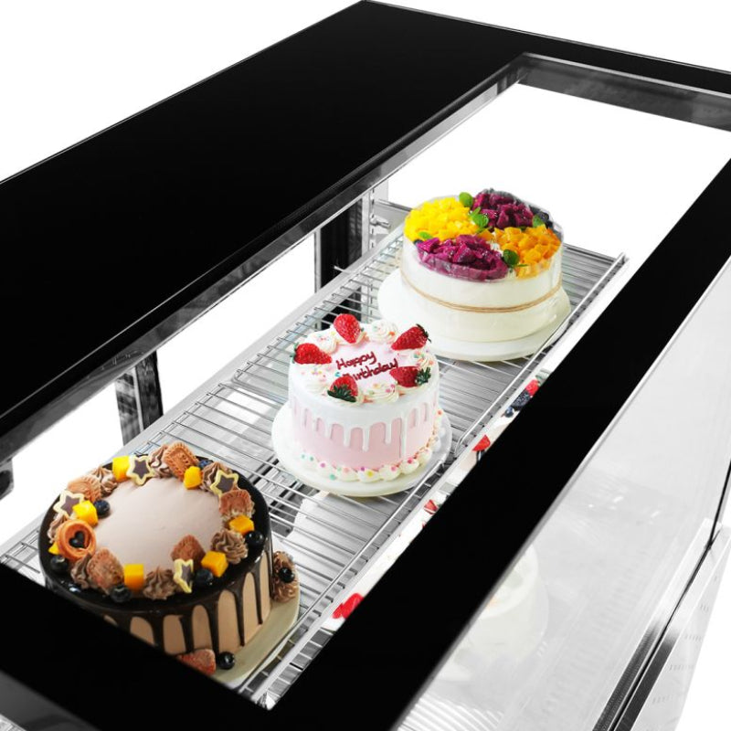 Bonvue SG120FA-2XB view looking down through the top glass at three decorated cakes on a wire shelf