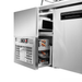 Stainless steel refrigerator with open door showing interior compartments.