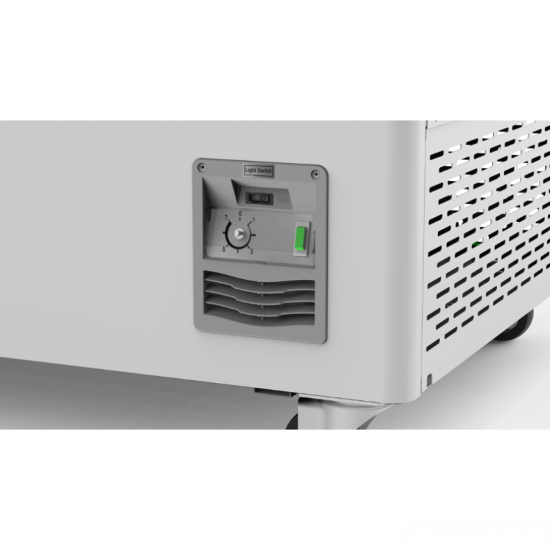 Close-up of a white appliance with a control panel on a light gray background