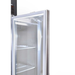 Empty commercial refrigerator with open door on a white background