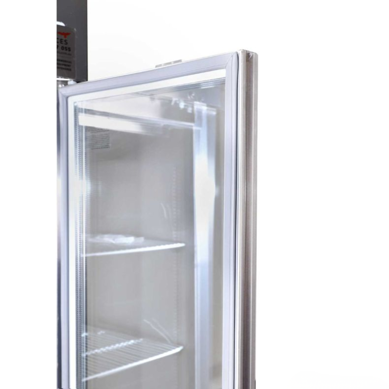 Empty commercial refrigerator with open door on a white background