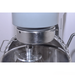 Close-up of a metal mixing bowl with a whisk attachment on a white background