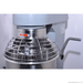 Bread machine with metal dough hook attachment on a white background