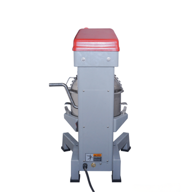 Gray machine with a red light on top against a white background