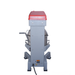 Gray machine with a red light on top against a white background