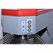 Control panel with red, green, and gray buttons on a machine.