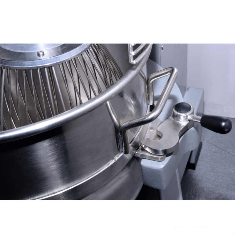 Close-up of a metal kitchen appliance with a filter and handle on a white background