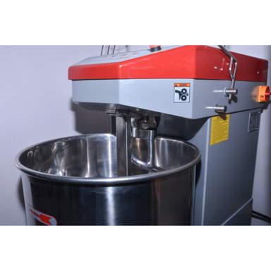 Bread mixer with a red top and silver bowl on a white background