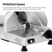 Metallic meat slicer with polished base on a white background