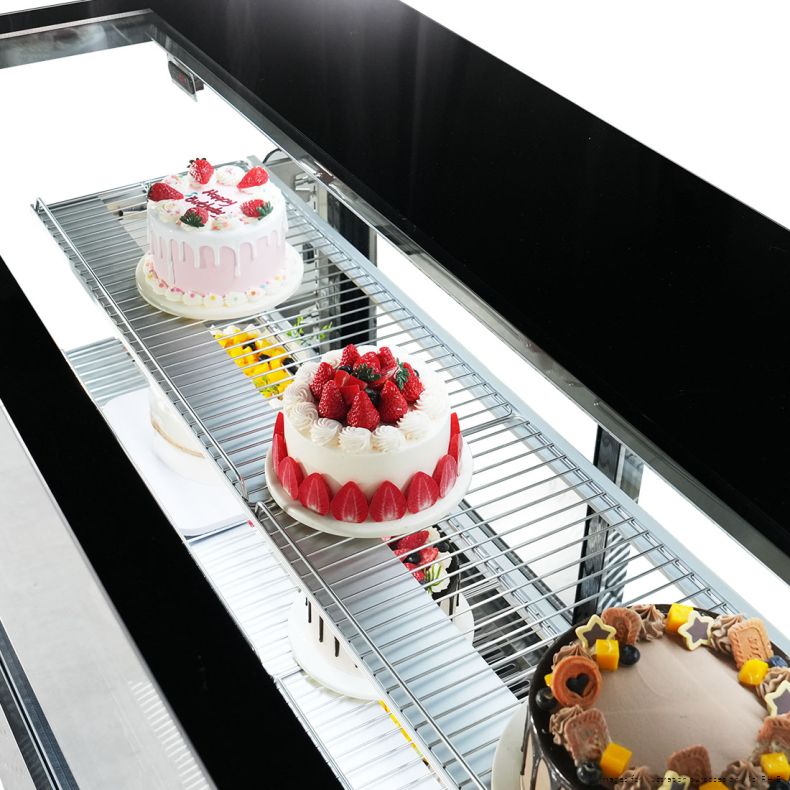Bonvue SG200FA-2XB view looking down through the top glass at decorated cakes on a wire shelf