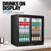 Thermaster LG-208SC black two-door bar fridge stocked with soft drinks, water and beer, under a bench in a bar, captioned drinks on display